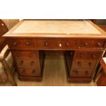 A Victorian twin pedestal kneehole desk, fitted nine drawers, leather inset top