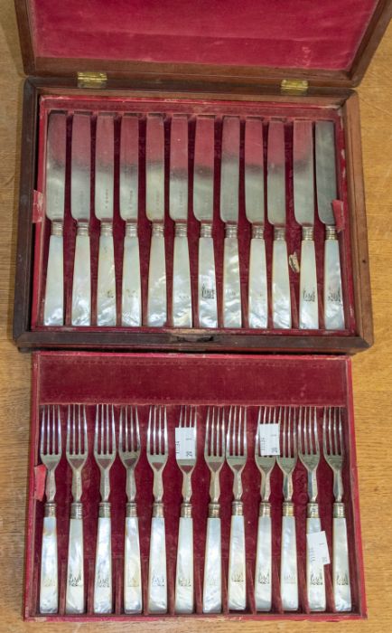 A set of eighteen 19th Century silver plate and mother-of-pearl handled fruit knives and forks, each