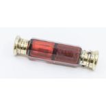 A Victorian silver-gilt mounted facet cut ruby glass double ended scent bottle, the cover collar