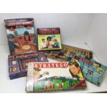 A collection of vintage boxed games including Moviemaker and Labyrinth