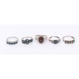A collection of five Gems TV coloured diamond rings to include three set with blue diamonds, sizes