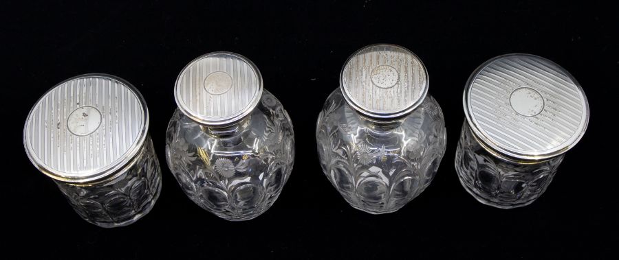 A matched four piece George V silver mounted and cut glass toilet set comprising two large bottles - Image 2 of 2