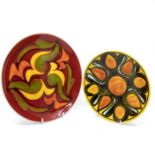 Poole Pottery: 2 Poole Pottery Delphis plates one on red ground and one on yellow ground, shape