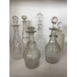 Six assorted clear glass decanters to include hobnail cut tantalus decanter [6]