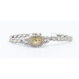 A 14k white gold Talis diamond cocktail watch with baton numerals, Swiss jewelled movement with