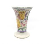 Poole Pottery: A Poole Pottery trumpet shape vase with floral decoration. Height approx 23.5cm.