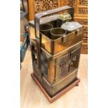 An early 20th Century portable brass cooking stove on stand with accessories to include lamp, food