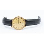 A gents 9ct gold Tissot wristwatch, circa 1960's, comprising a round gold tone dial with applied