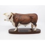 A Beswick parian ware Connoisseur model of a Hereford Bull on wooden plinth