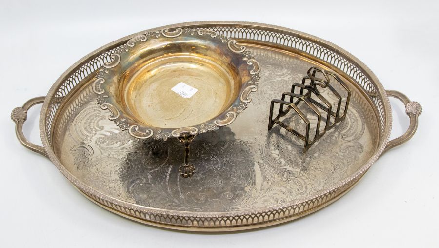 A late Victorian silver raised bowl, wavy cut card rim on three scroll and foliate feet,