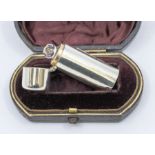 A Victorian small plain silver cylindrical scent bottle, gilt interior, face cut glass stopper,