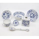 A collection of Meissen china items to include blue & white cup and saucer, place name holder, small