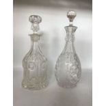 Two clear glass decanters; one bell shaped with wide fluted body on fluted star cut base, hand blown