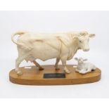 A Bewick parian ware Connoisseur model of a Charolais cow and calf, on wooden plinth