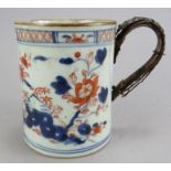 A mid to late eighteenth century Chinese hand-painted blue and white and red mug, c. 1750-75. It