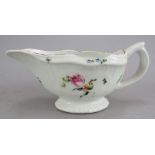 An eighteenth century Derby porcelain hand-painted sauce boat of moulded form, c. 1770. The