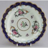 A late eighteenth century porcelain Worcester hand-painted flower pattern moulded plates with gilded
