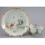 An eighteenth century Chinese hand-painted porcelain tea bowl and saucer, c. 1760. It is decorated