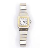 A Cartier Santos gold and stainless steel lady's wristwatch, worn with some scratches to glass, with