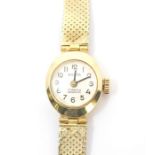 A 14k lady's 'PORTA" watch with Roman numerals to the dial and 14k watch strap, stamped '585'. Total