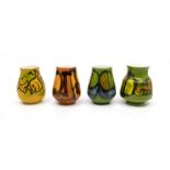 Poole Pottery: 4 Poole Pottery Delphis small vases 2 on green ground, 1 on orange ground and 1 on