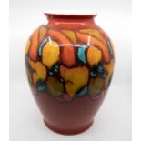 Poole Pottery: A Poole Pottery Delphis baluster vase on red ground, Height approx 35cm. Marks to the