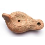 Terracotta Oil Lamp.  Roman style with a scallop shell type design in the centre. Old label attached