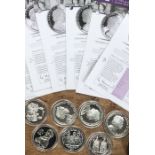 A collection of 7 Commonwealth Sterling Silver Crowns with Certificates, with other coins.