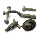 Roman Artefact Group.  Circa, 1st-3rd century AD. The lot includes, three roman brooches. A crossbow