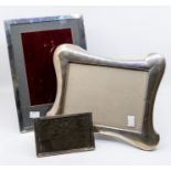 Two large silver mounted framed, one rectangular, the other shaped, both easel backed and a