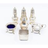 A collection of seven various 20th Century silver condiments to include: pair of baluster pepper