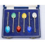 A group of table silver to include: a set of six-gilt and harlequin enamel coffee spoons, by