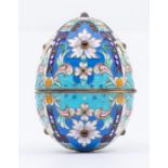 A late 19th Century Russian silver-gilt and enamel hinged egg, polychrome cloisonne enamel set