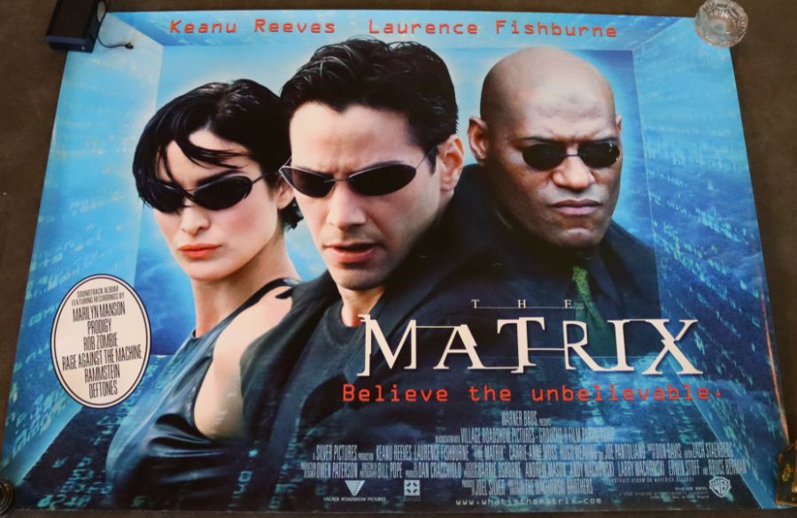 A collection of vintage movie posters 'The Matrix' (1999), 'Matrix Reloaded' (2003), 'The Matrix - Image 3 of 3