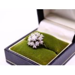 A  diamond floral  ring, weight: 5g approx.  size: (J)