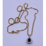 An 18ct sapphire and diamond pear-shape pendant an 18ct snake link chain, gross weight 7.0g, total