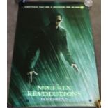 A collection of vintage movie posters 'The Matrix' (1999), 'Matrix Reloaded' (2003), 'The Matrix