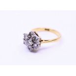 A diamond  floral ring,with central solitaire  weight: 4.17g approx.  size: (K)