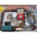 A collection of coins to include case 77' silver coin