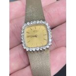 SEIKO SILVER (GOLD VERMEIL) WATCH WITH STONE SET BEZEL (LADIES)