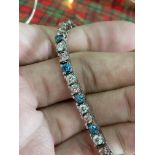 APPROX. 6CT 18CT WHITE GOLD TENNIS BRACELET (BLUE/ WHITE/ PINK DIAMONDS)