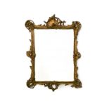 Rocaille mirror LOUIS XV-STYLE WORK Stuccoed giltwood, pitted mirror. H : 102 cm Width : 75 cm