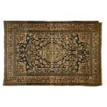 Persian rug, Sarouk Black ground, tobacco-coloured floral dŽcor between two columns and arches,