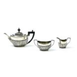 John Round & Son Tea set English silver and ebony, composed of a teapot, a sugar bowl, and a