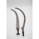 Two large Zande sickles CONGO, 19TH CENTURY Carved blades, wood and iron. Width : 82 cm and 75 cm