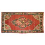 Karabagh kilim Red ground, decorated with flowers in a grey medallion, grey spandrels full of