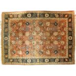 Tabriz or Bakhtiyar rug, Red or brown ground covered in Shah Abbas flowers, blue floral border