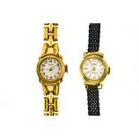 Pontiac Lot of 2 lady's bracelet watches 1. Lady's 18 kt gold Pontiac Silver-plated dial signed "