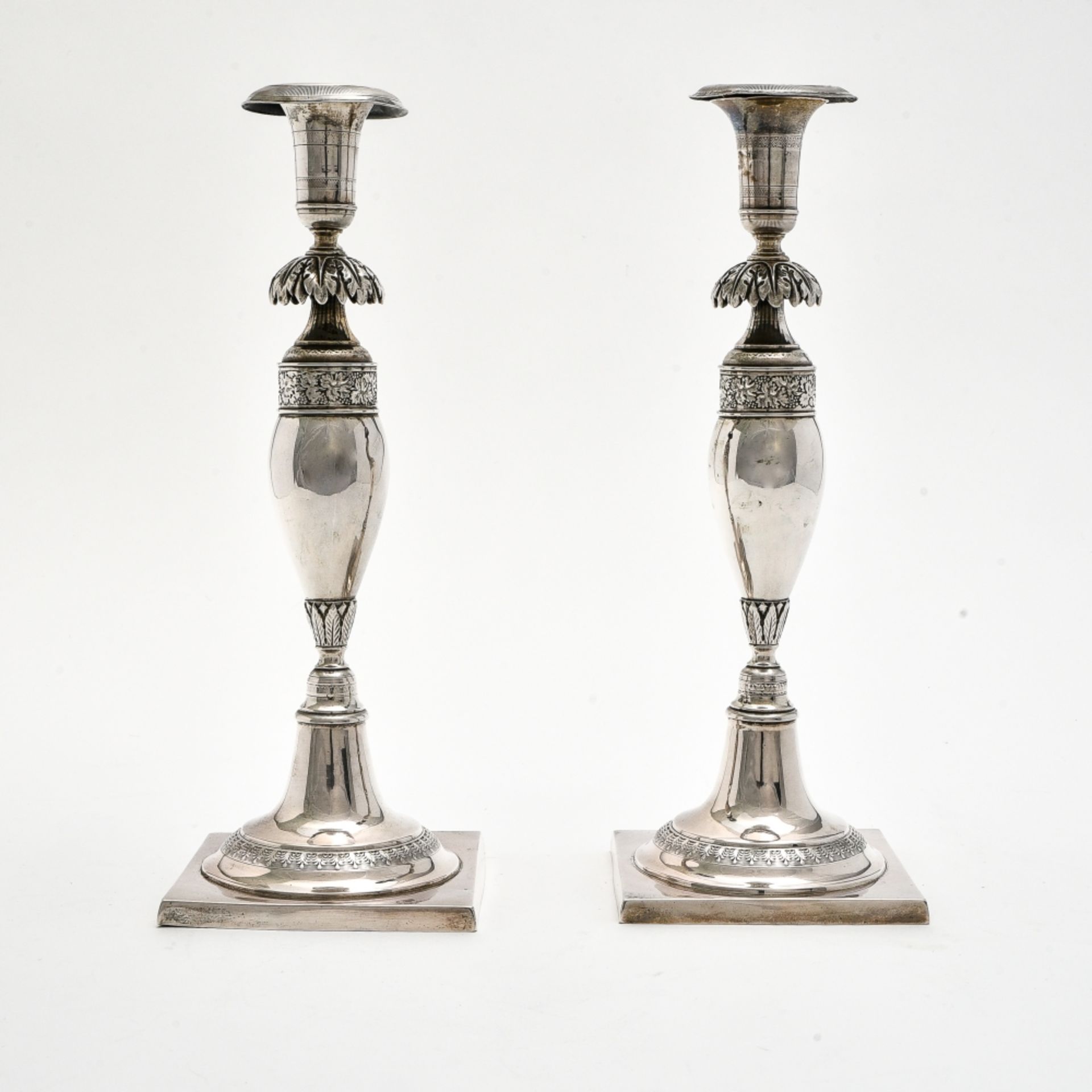 Pair of torches BERLIN, MID-19TH CENTURY silver decorated with grapevines and palms. Assayer's