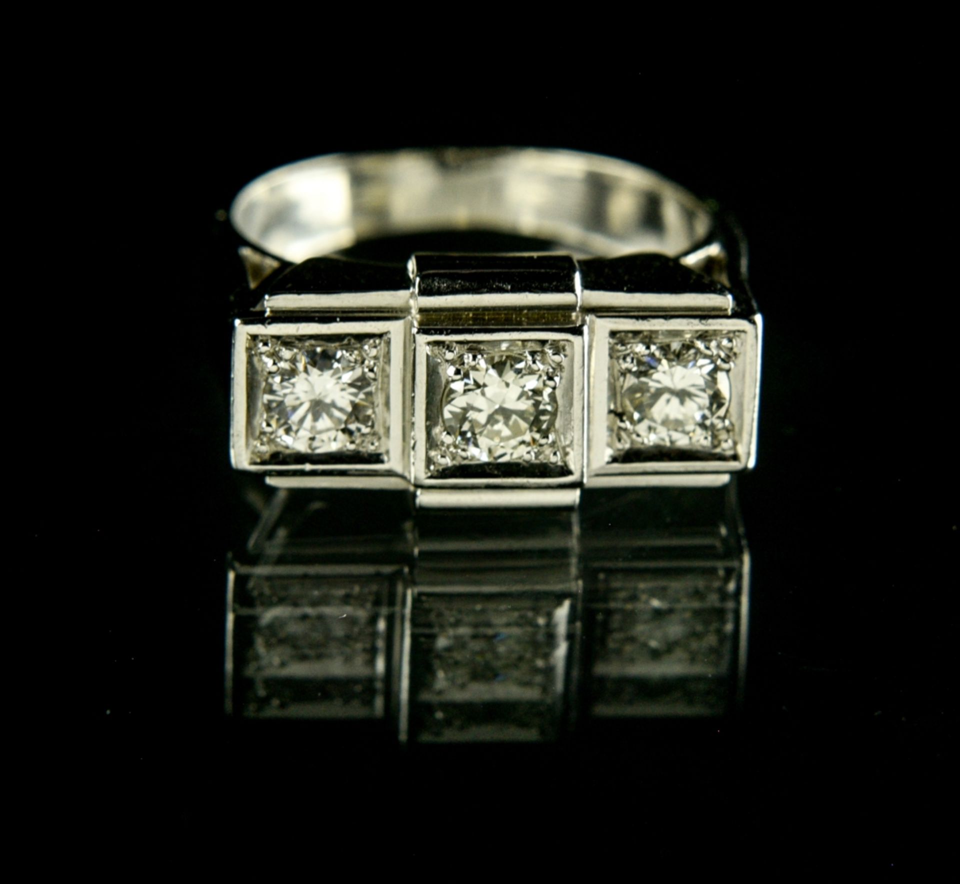 Trilogy tank ring Platinum, set with three brilliant-cut diamonds respectively weighing 0.30 ct